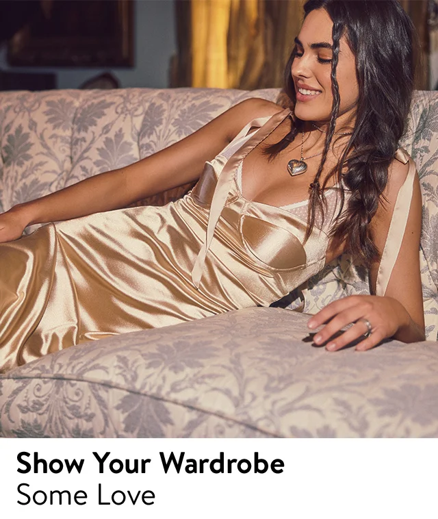A woman wearing a silky gold dress.