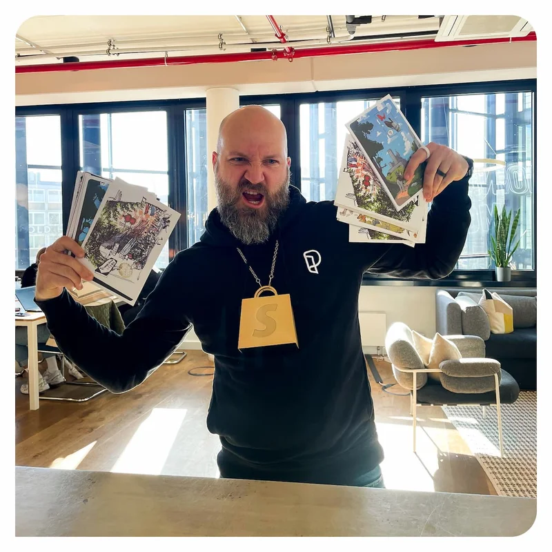 Jan wearing the Shopify one million sales award around his neck, making a grimace.
