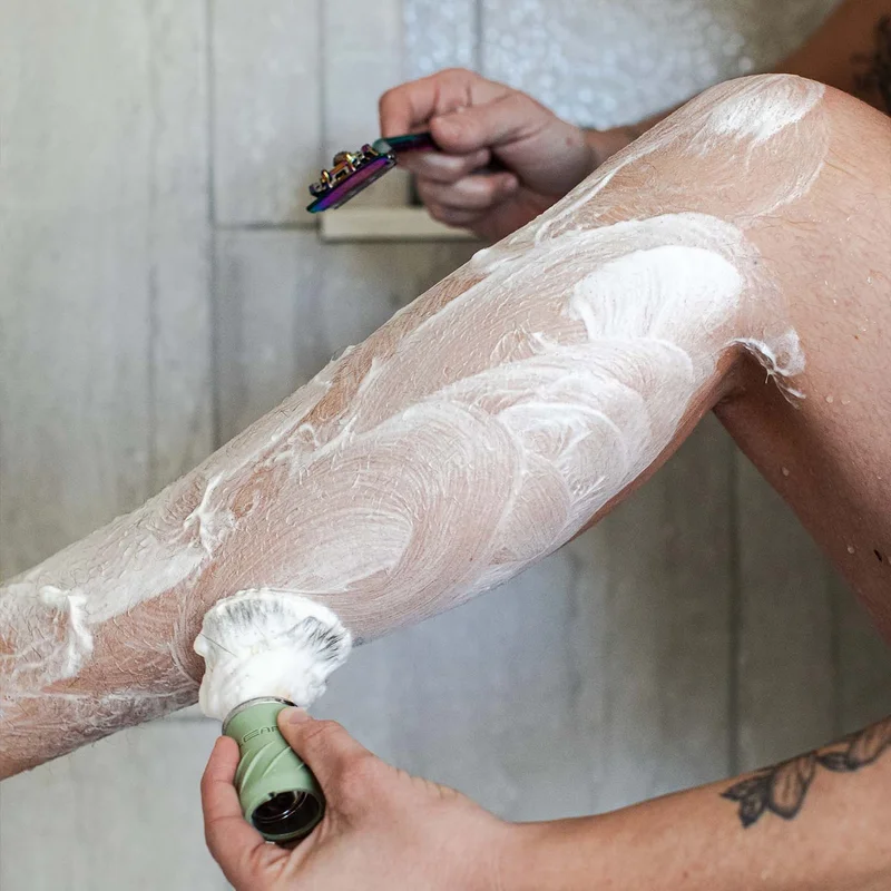 Lathering on a leg in the shower