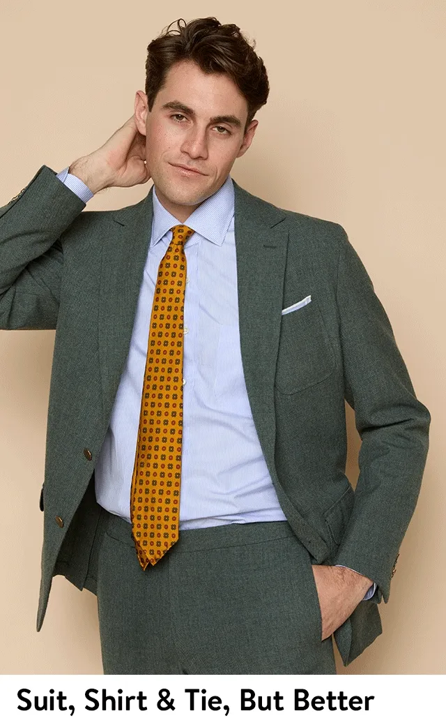 A man wearing a suit, shirt and tie.