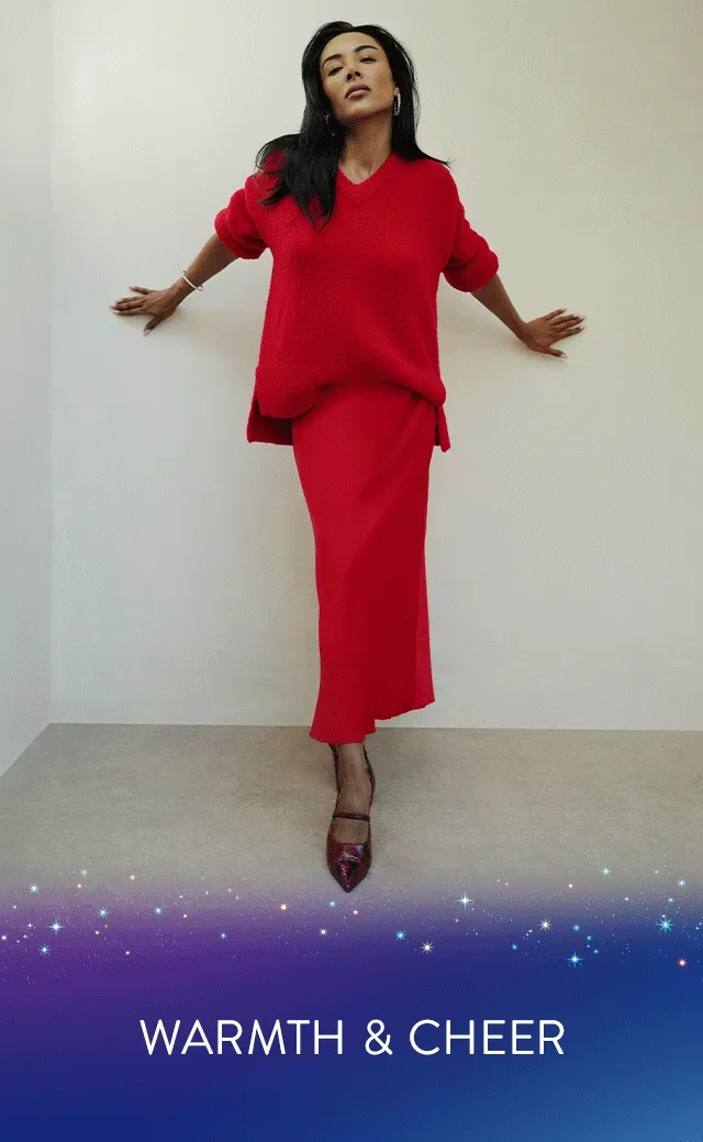A woman wearing a red sweater.