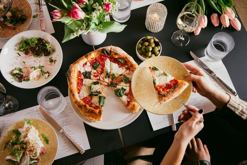 AperiBar tablescape with pizza and salad