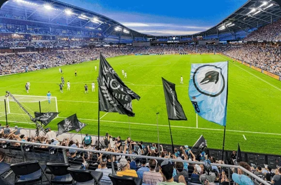 Rotating image of Allianz Field, an MNUFC cap, and a custom painted jacket