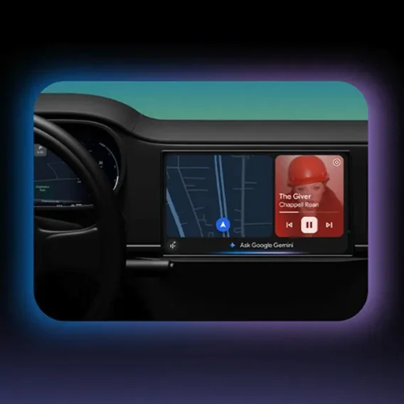 An image of an car dashboard display with maps and music, side by side