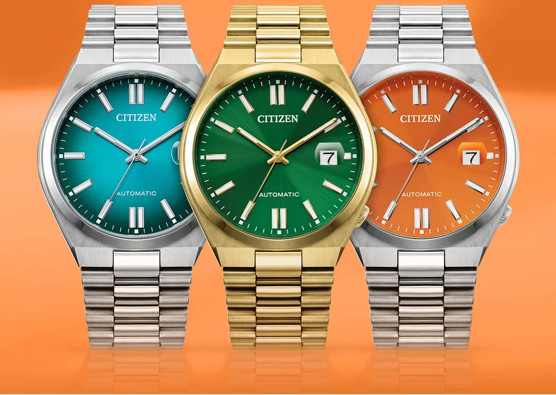 Vibrant New Tsuyosa collection—a deep green dial, balanced by a gold-tone stainless steel bracelet, a rich orange dial that pops off a silver-tone stainless steel case, and a luxurious teal gradient dial.