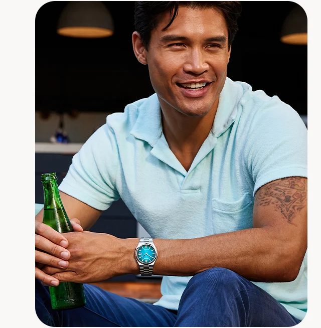 A man wears a Tsuyosa in a luxurious teal gradient dial and stainless-steel bracelet