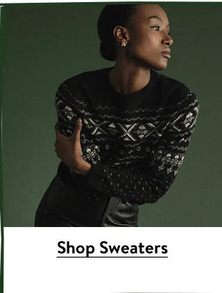 A woman wearing a sweater with a Fair Isle pattern.
