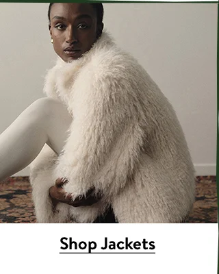A woman wearing a bohemian faux-fur jacket.