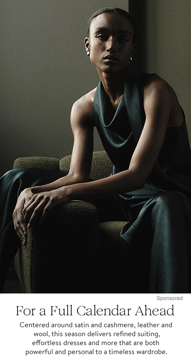 A woman wearing a sleeveless satin top and matching satin pants.
