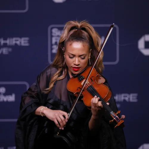 A violinist plays at the Chase Sapphire Reserve lounge.