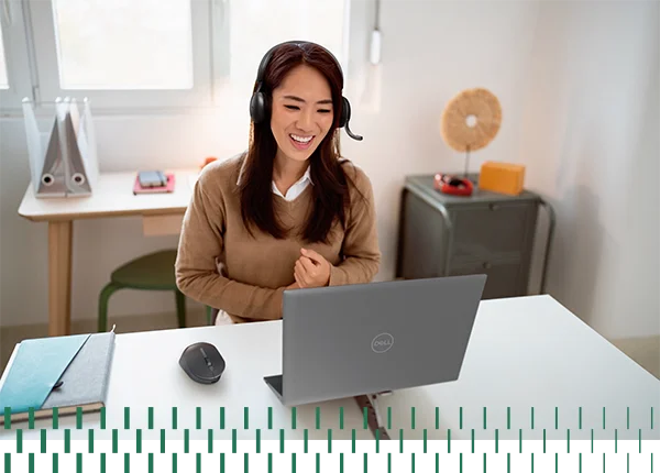 Young Woman Smiling While Working from Home Office
