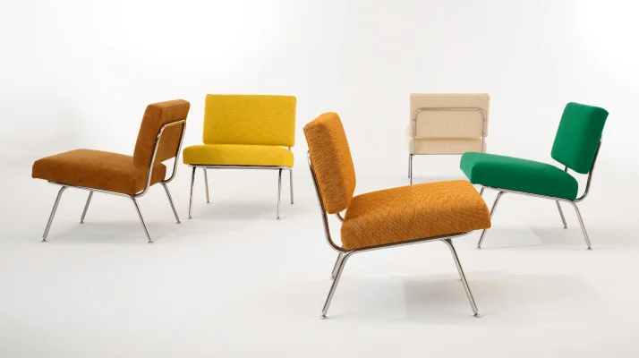 Whitesweep of a colorful group of Florence Knoll Model 31 Lounge Chairs in different upholsteries.