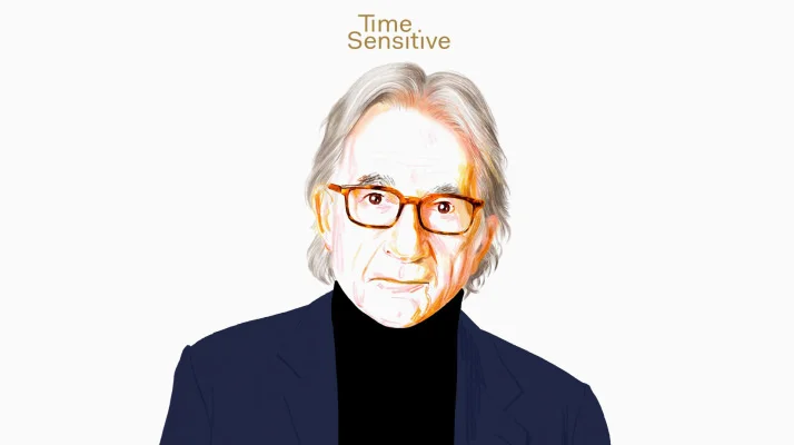 Time Sensitive podcast episode graphic of a portrait illustration of Paul Smith wearing tortoise shell frames, a navy blue blazer, and a black top.