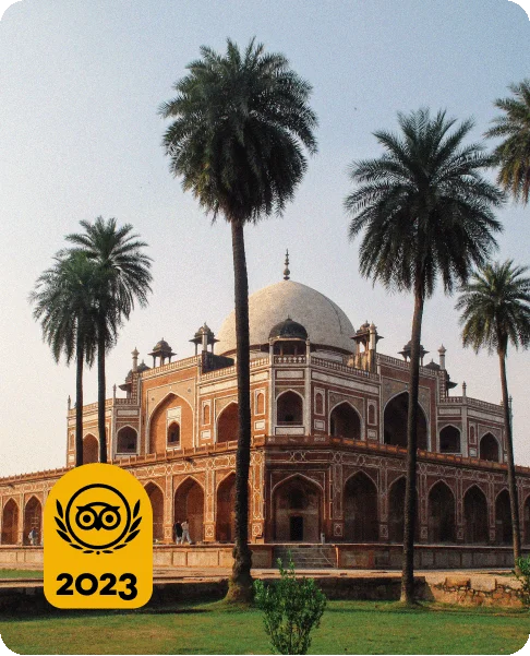 Image Description: A grand palace with multiple levels and a domed top with tall trees in front. A Travelers’ Choice Awards Best of the Best yellow logo is in the bottom left corner.
