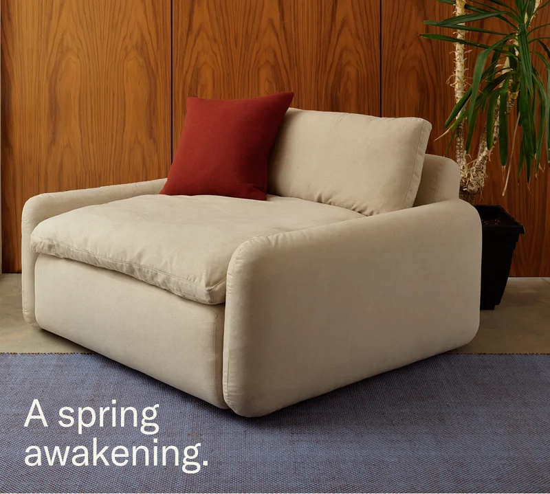 A spring awakening. (Pictured: The Sink Down Lounge Chair & Grid Rug)