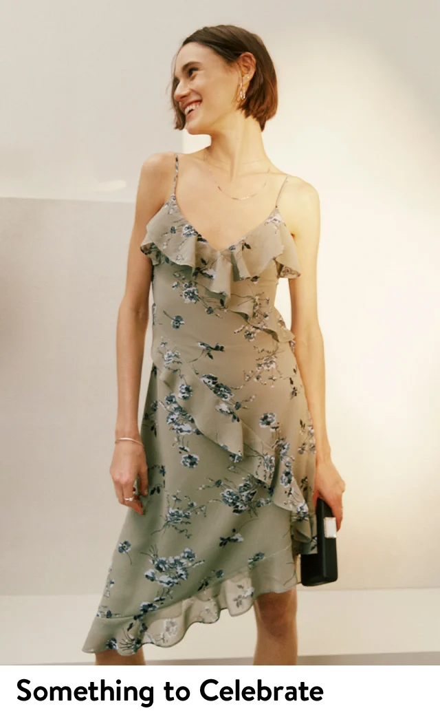 A woman wearing a tiered floral dress.