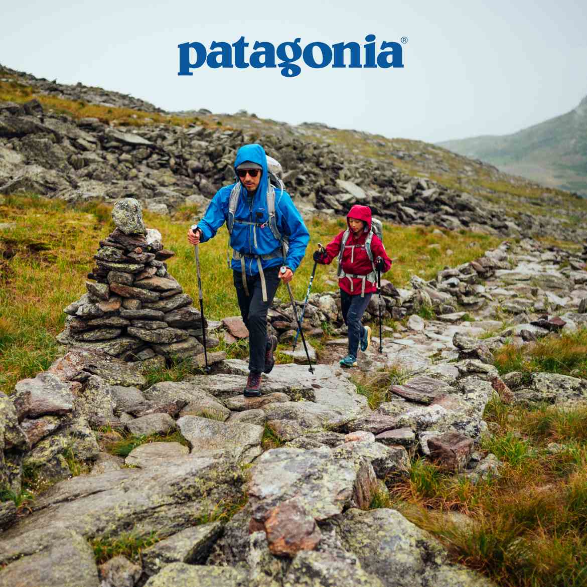 Patagonia. Photo of two people trekking in the rain.