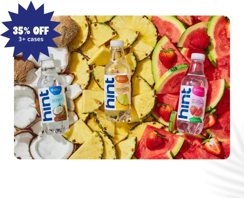 Coconut, Pineapple, and Strawberry Watermelon bottles on fruit