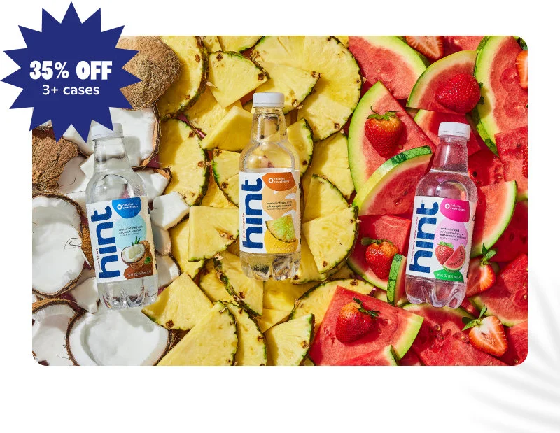 Coconut, Pineapple, and Strawberry Watermelon bottles on fruit