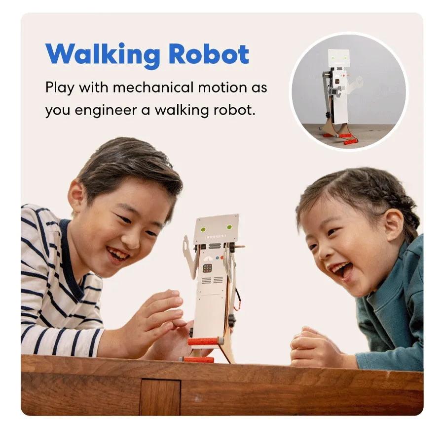 Two children excitedly playing with a mechanical walking robot they assembled.