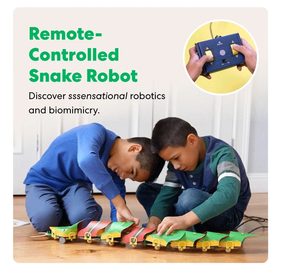 Child maneuvering a robotic snake using a remote control, showcasing its flexible motion.