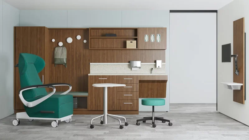 A 3D rendering of a clinical exam room featuring a green Herman Miller Nemschoff Ava recliner and Compass System
