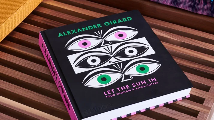 Alexander Girard: Let the Sun In - Hardcover book on slatted walnut bench.