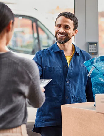 An IKEA delivery worker arrives to a customers home with their order.