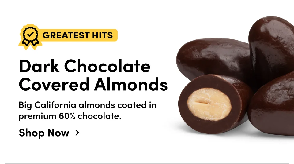 Greatest Hits | Dark chocolate covered almonds. Big California almonds coated in premium 60% chocolate; Shop now >