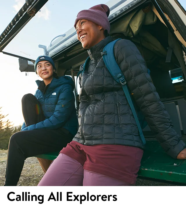 Two women wearing warm jackets from The North Face.