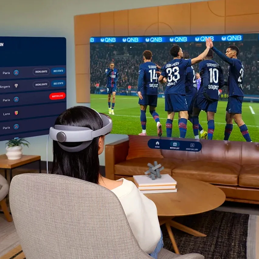 A person wearing an XR headset viewing a soccer match with live player stats displayed on a side panel.