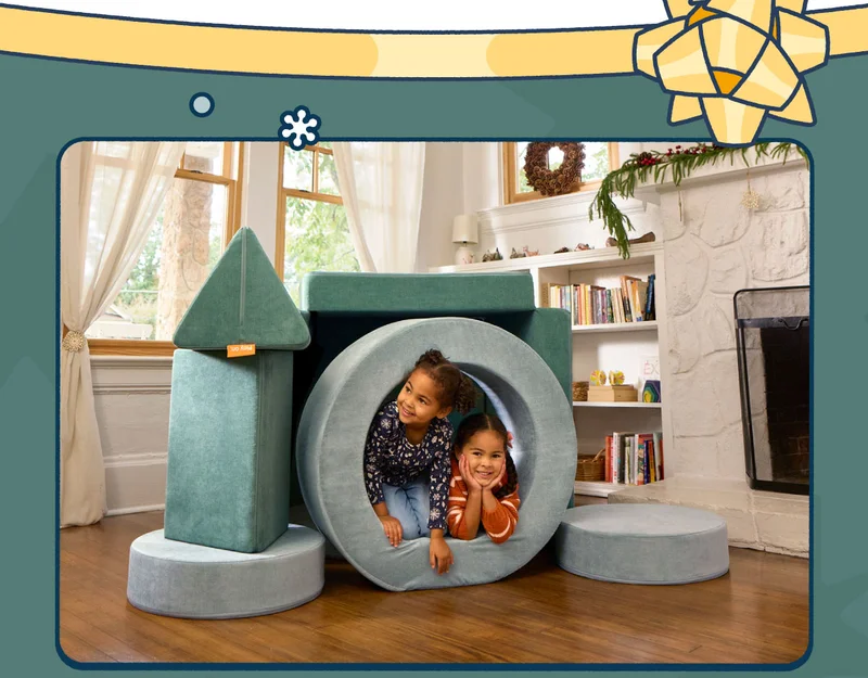 Two children play in a fort made from a Seamonster Nugget and a Surfside Chunk.