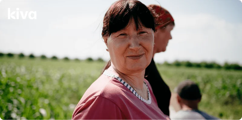 Image Description: An image of a person smiling in a field.