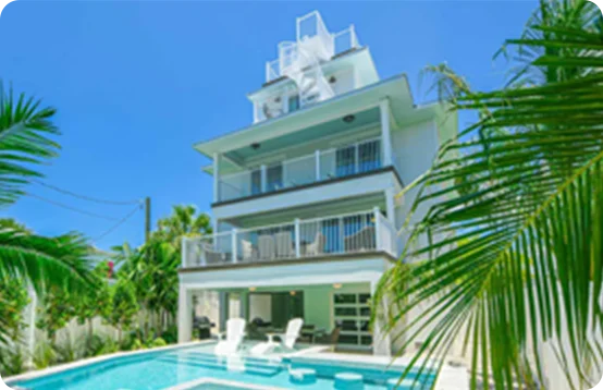 Enjoy poolside relaxation and sugar-white beaches just minutes away from a private retreat in Siesta Key, Florida.