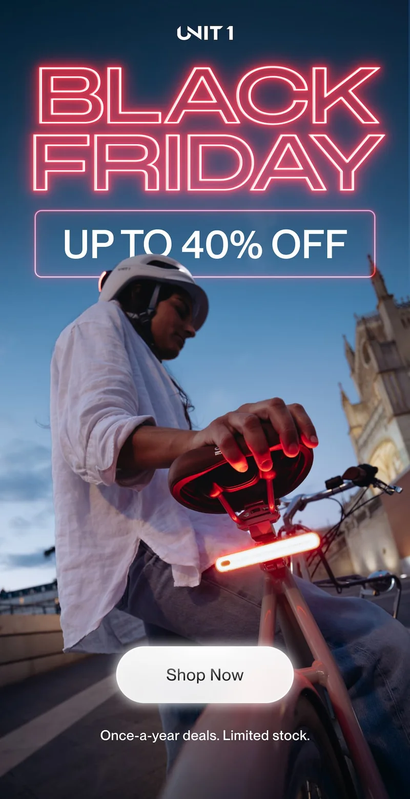 Rider using a UNIT 1 smart helmet and smart lighting at dusk, with Black Friday message and up to 40 percent off headline.
