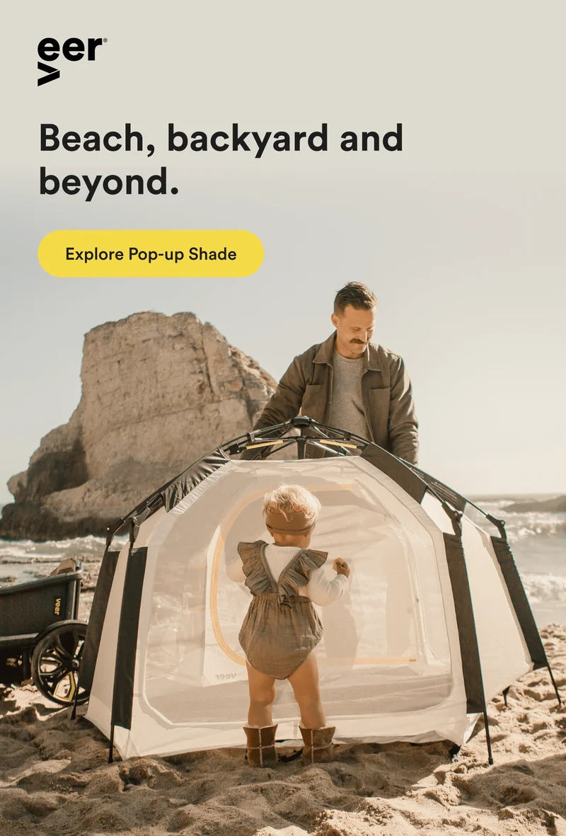 A father setting up the Basecamp on the beach
