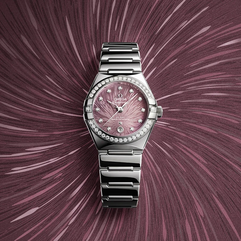 28 mm Constellation 28 mm model that is crafted in stainless steel and features a radiant diamond-paved bezel.