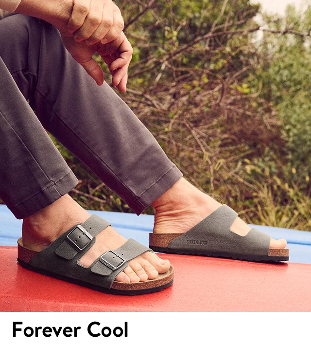 Model wearing classic Birkenstock sandals.