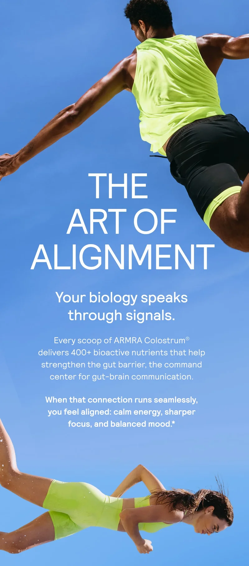 Two athletic individuals in bright neon activewear leap dynamically against a blue sky, representing vitality and balance. Text overlay reads: “The Art of Alignment. Your biology speaks through signals. Every scoop of ARMRA Colostrum delivers 400+ bioactive nutrients that help strengthen the gut barrier—the command center for gut-brain communication. When that connection runs seamlessly, you feel aligned: calm energy, sharper focus, and balanced mood.”