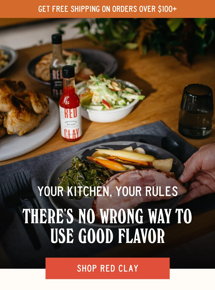 an image of a person pouring sauce on a hot sauce