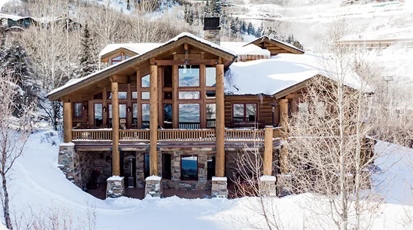 Reunite with friends in a relaxing space with floor-to-ceiling windows in Park City, Utah.