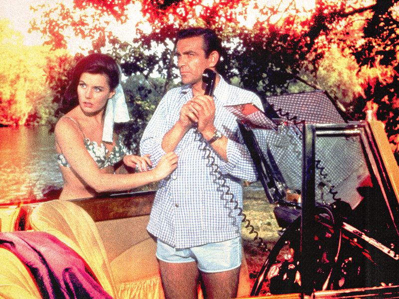 Image may contain: Sean Connery, Eunice Gayson, Electrical Device, Microphone, Adult, Person, Face, Head, and Photography