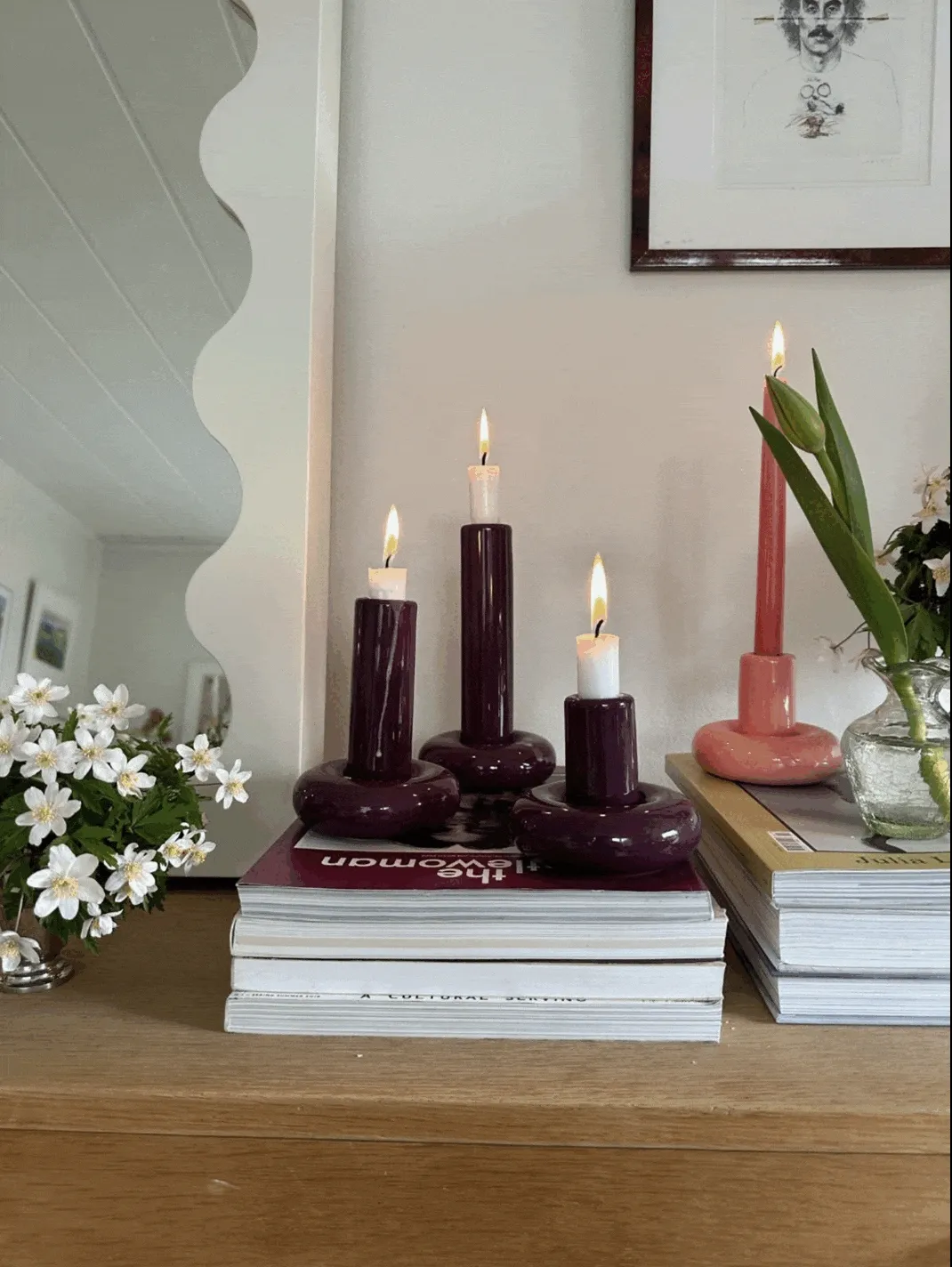 A GIF of colorful plates, candleholders, and planters