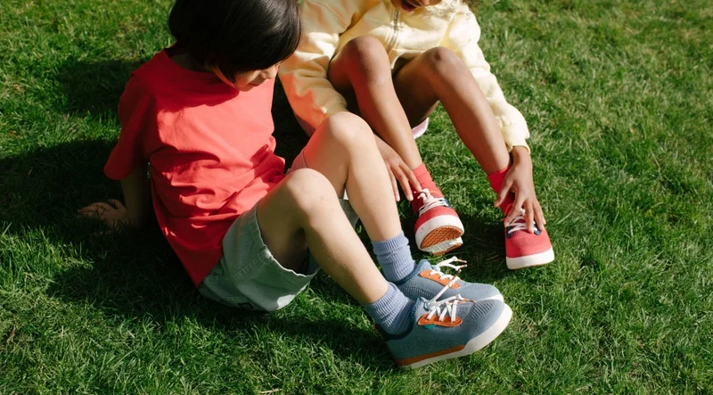 Graphics of kids wearing the newly redesigned kids shoes.