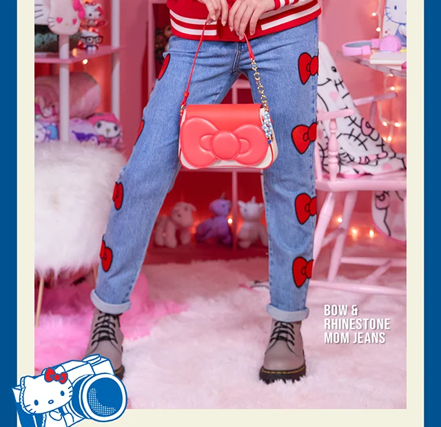 Product Shown: Varsity Hoodie, Bow and Rhinestone Mom Jeans, Red Bow Baguette Bag