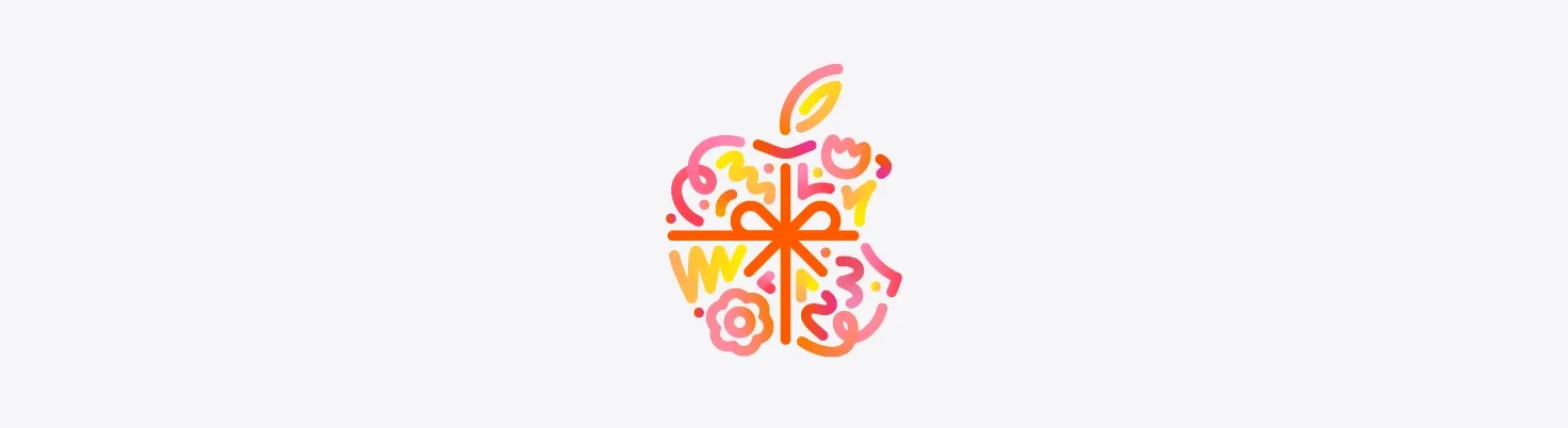 Dots, squiggles, spirals, and flower shapes in different hues of orange, pink, and yellow burst and spread across from behind Apple logo, wrapped in an orange color bow, made up of dots, squiggles, spirals, and flower shapes in different hues of orange, pink, and yellow