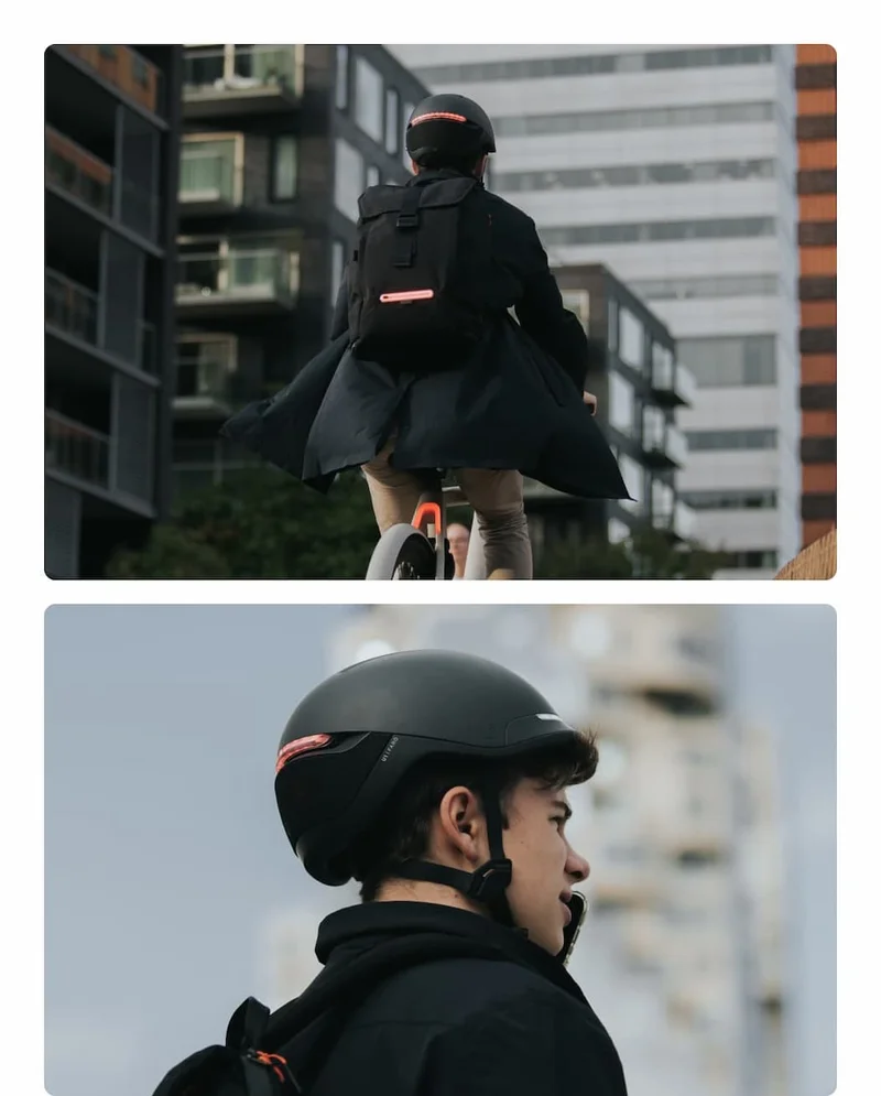 Urban commuter wearing UNIT 1 smart helmet and TORCH backpack while riding through the city.