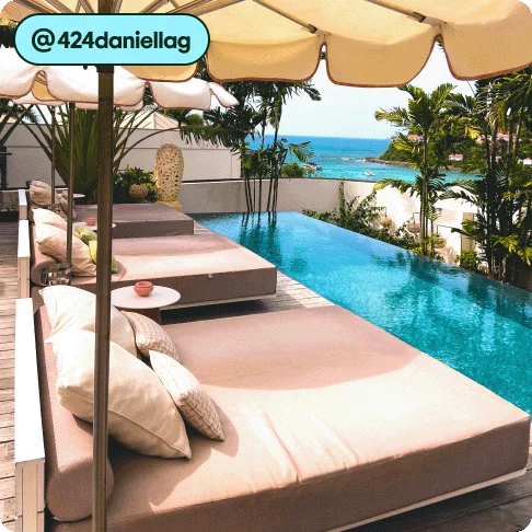 Image Description: Lounge chairs by a pool.