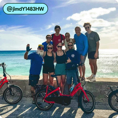 Image Description: A group of people with bikes at the beach.