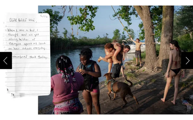 Teens and kids swimming in a canal fed into by the Detroit River.